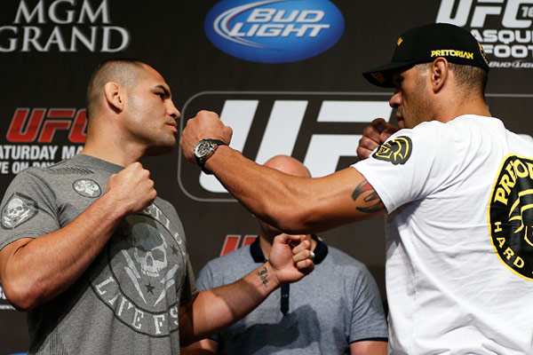 All three of SI.com's UFC experts predict Cain Velasquez (left) to defeat Antonio Silva. (Zuffa LLC via Getty Images)
